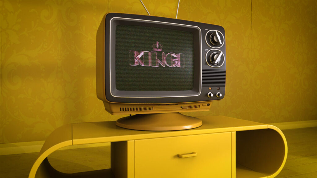 Kokonaan keltaisessa huoneessa on musta televisio, jonka ruudussa lukee Kingi.